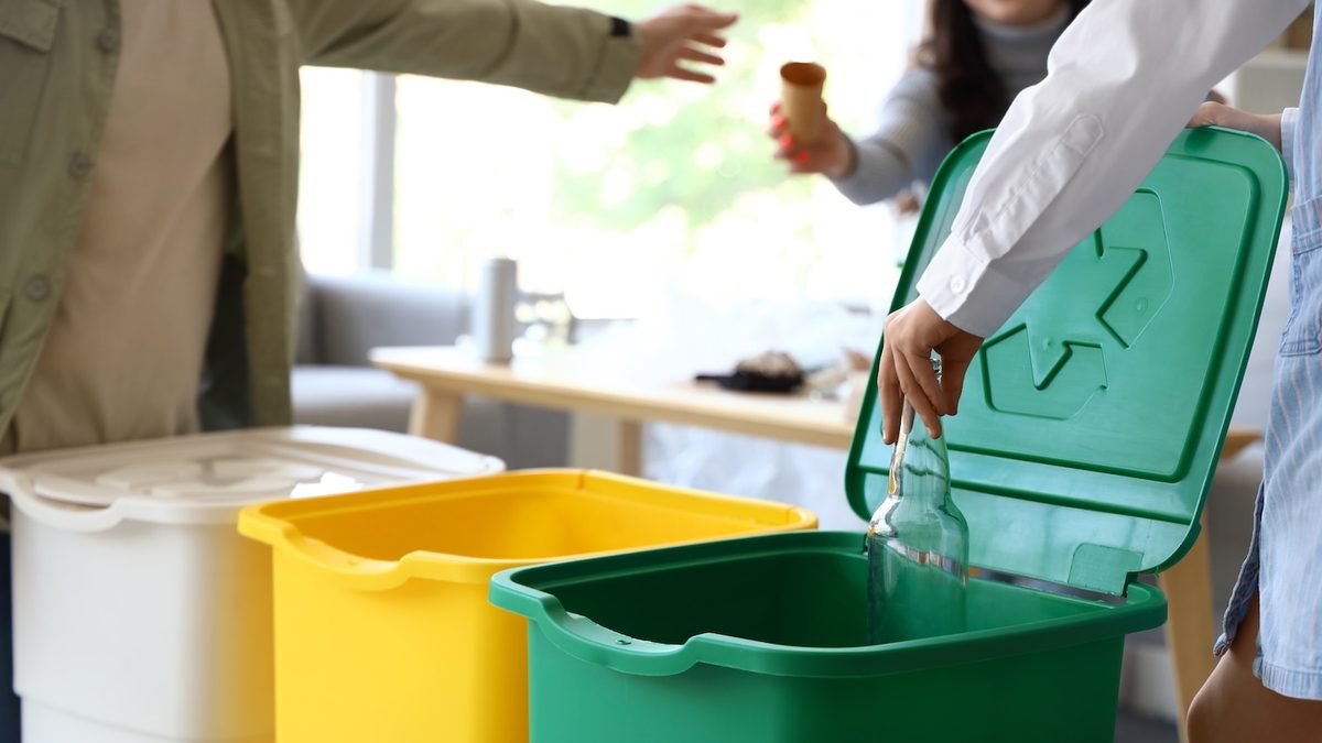 Sorted recycling and waste being separated by hand on set